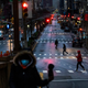 People cross Park Av. after it was announced that some streets will be shut as lockdown continues in response to the coronavirus (COVID-19) outbreak on March 27, 2020 in New York City. Mayor Bill de Blasio chose four streets across four boroughs to test whether shutting down streets to vehicular traffic would increase social distancing among pedestrians during the COVID-19 pandemic shutdown.